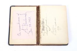 A late 19th/early 20th century leather autograph album containing approximately 25 signatures of