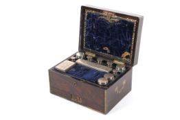 A Victorian rosewood and brass mounted toilette box.