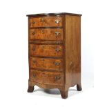 An early 20 th C walnut Bow fronted chest of 5 graduated drawers with cross banded decoration to