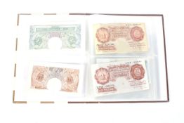 An album of 11 English bank notes.