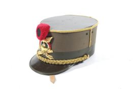 An Italian Artillery dress cap with crossed gilt canons , swords and a grenade ,