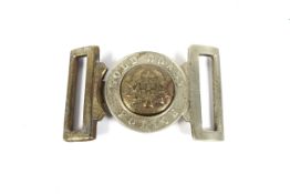 A Gold Coast Police interlocking belt buckle marked with Coat of Arms and labqelled to border 9cm