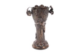 A patternated bronze art noveau vase.