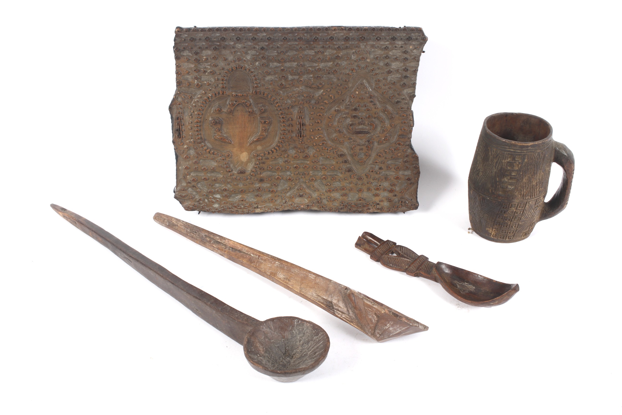 Ethnographic Native Tribal : a quantity of carved wooden items including a loop handled carved