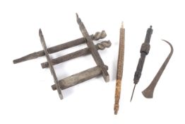 Ethnographic Native Tribal : A quantity of carved wooden tools including a mounted roller,