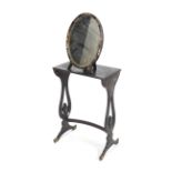 A 1920's Chinoiserie decorated oval Easel table mirror together with a Chinoiserie decorated