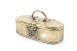 An 18th/19th Century brass oval safe box. With trefoil hinges and swing handle, 20.