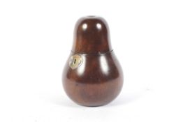 A pear wood tea caddy of pear shape with white metal shaped escutcheon, 15.