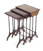 An early-mid 20th century Nest of three mahogany Occasional Tables with twin turned column supports