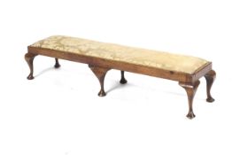 A Georgian-style mahogany framed rectangular footstool, with some 18th century and later elements.