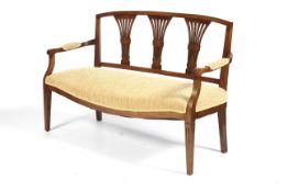 An Edwardian style Oak 3 seat sofa bench with ribbed pale yellow sprung seat,