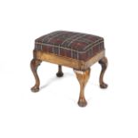 A 20th century walnut Queen Anne Style Footstool with cabriole legs and pad feet,