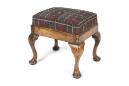 A 20th century walnut Queen Anne Style Footstool with cabriole legs and pad feet,