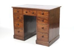 A circa 1900 Mahogany Knee Hole Pedestal Desk with three short frieze drawers,