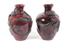 Burslem Artwares, a pair of Royal Doulton Flambe Fuyang dragon vases, nos `23 & 59 /1999,