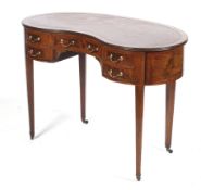 An Edwardian Kidney Shaped ladies Writing Desk the mahogany with satinwood cross banding and