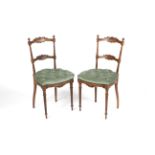 A pair of circa 1900 French button back fruitwood over stuffed boudoir chairs with fluted columns