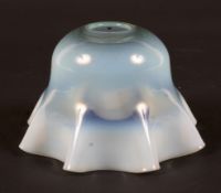 An Edwardian vaseline glass oil lamp shade in the style of James Powell, Whitefriars.