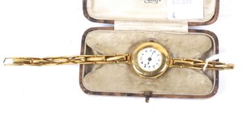A 9ct gold cased round bracelet watch, circa 1921.