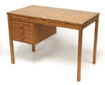 A contemporary Domino pine desk.