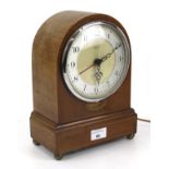 A converted mahogany cased dome top mantle clock. With an electric Smiths Sectric movement.