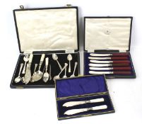 A collection of plated flatware, in boxes,