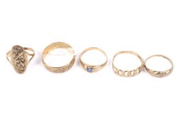 Five 9ct gold rings.