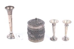 A pair of small silver tapering spill vases and other items.