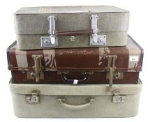 Three vintage suitcases.