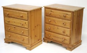 A pair of contemporary pine chest of four drawers.