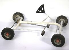 A vintage toy pedal go cart frame.