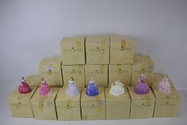 A collection of twenty two Coalport Minuette lady figures.