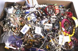 A large quantity of costume jewellery including a beadwork bangle and a fluorite chip necklace.