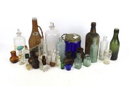 A collection of assorted vintage bottles and glassware.
