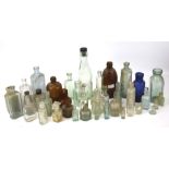 A collection of assorted vintage glass bottles.