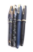 A collection of four vintage fountain pens.