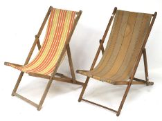 A pair of vintage foldable deckchairs.