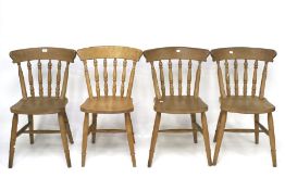 A set of four pine kitchen dining chairs.