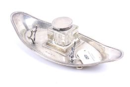 A silver shaped-oval ink stand.