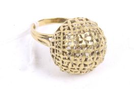 A bombe ring pierced with a fluted and star lattice. On a twin-shank stamped '750', size S+, 10.