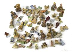 A large collection of assorted Wade Whimsies miniature pottery figures.