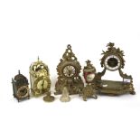 A collection of various mantel clocks and part garnitures.