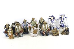 A collection of thirteen assorted Chinese ornamental ceramic figurines.