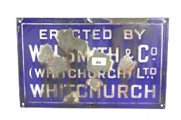 A vintage 'W. H. Smith & Co Ltd, Whitchurch' blue enamel adverting metal sign.