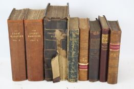 Eight antique books.