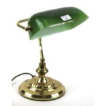 A contemporary bankers desk lamp with green shade.