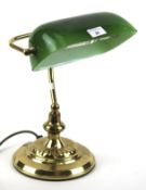 A contemporary bankers desk lamp with green shade.