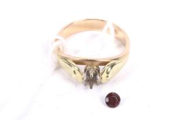 A vintage Continental bi-colour gold and garnet single stone ring.