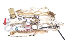 A box of assorted costume jewellery. Including necklaces, bangles, watches, etc.