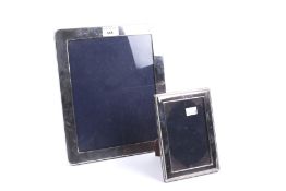 Two modern silver mounted rectangular picture frames.